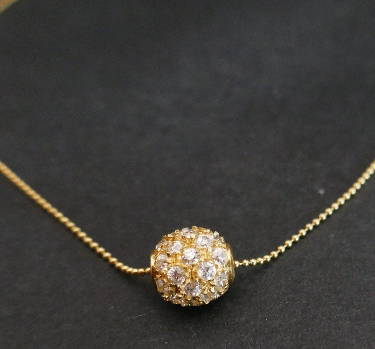 Yellow gold pendant and chain White stones