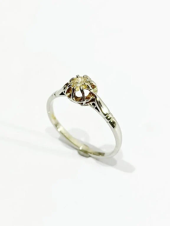 Solitaire gold and diamond ring
