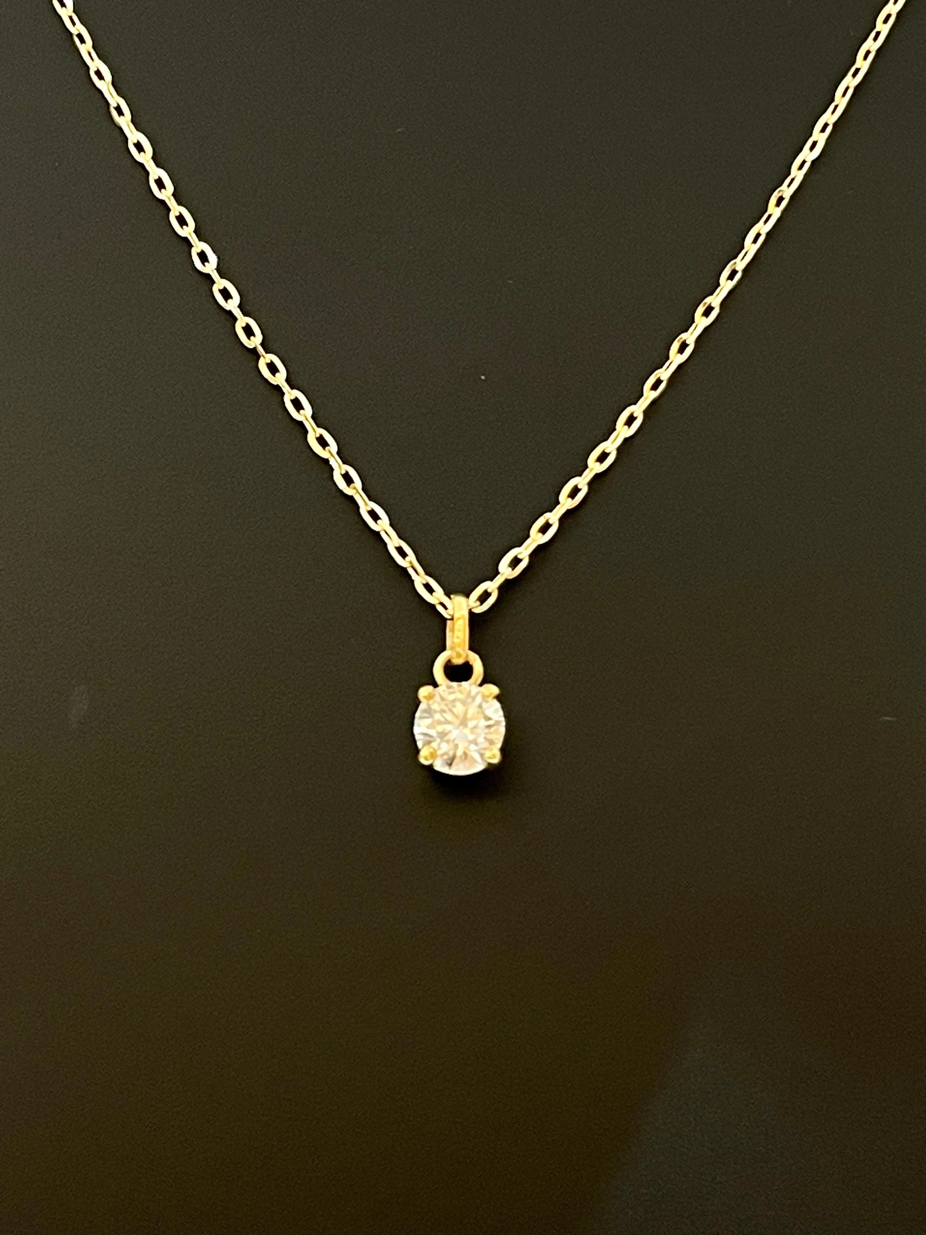 Diamond solitaire necklace 0.56 carat yellow gold