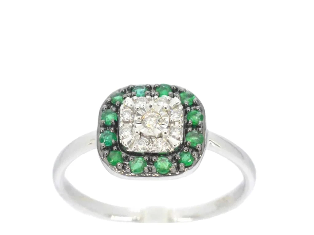 White gold ring with diamonds and emerald