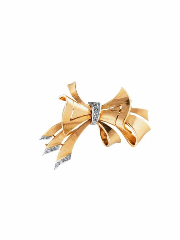 Gold bow brooch platinum 1940.