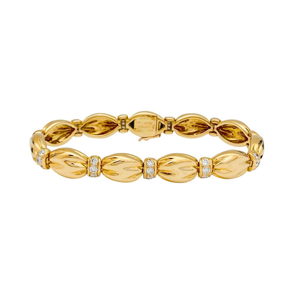 Van Cleef & Arpels bracelet, “Drapé”, yellow gold, diamonds.