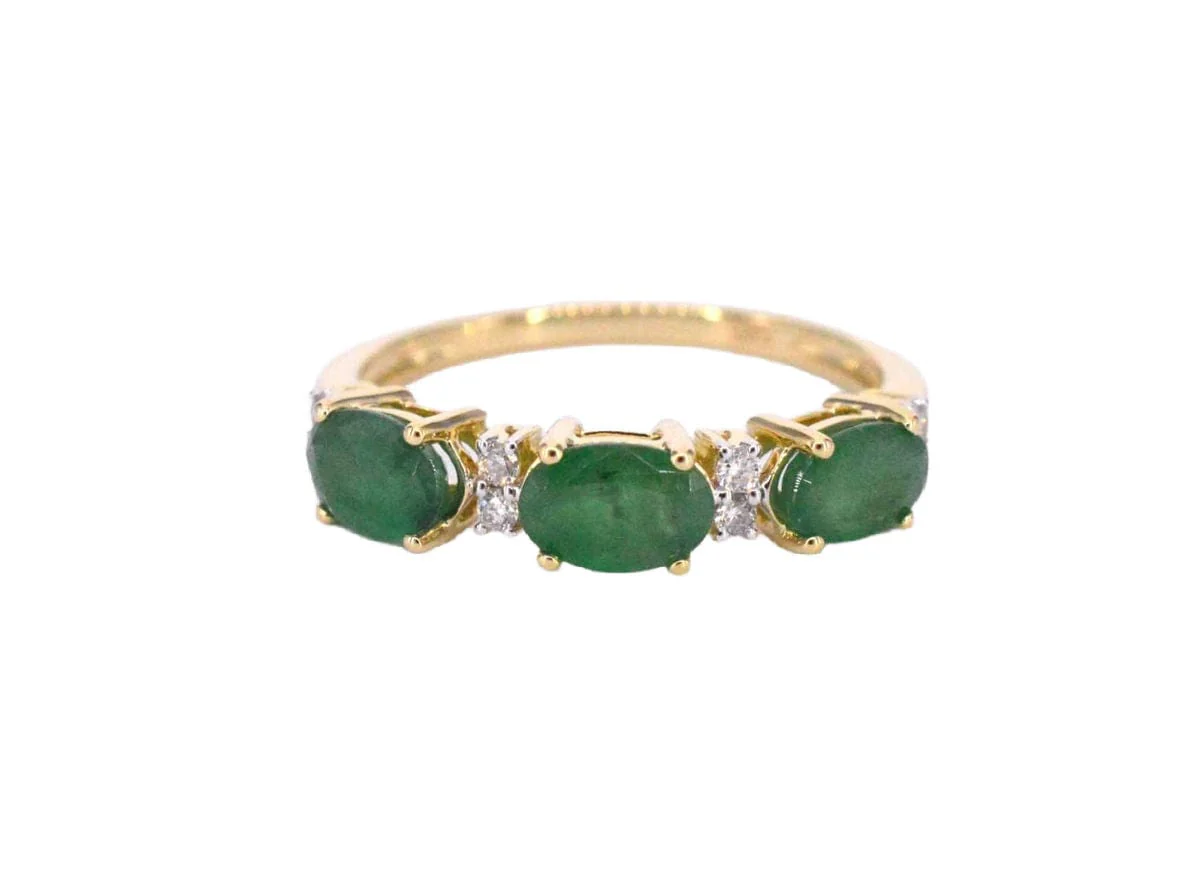 Gold ring with diamonds and emerald