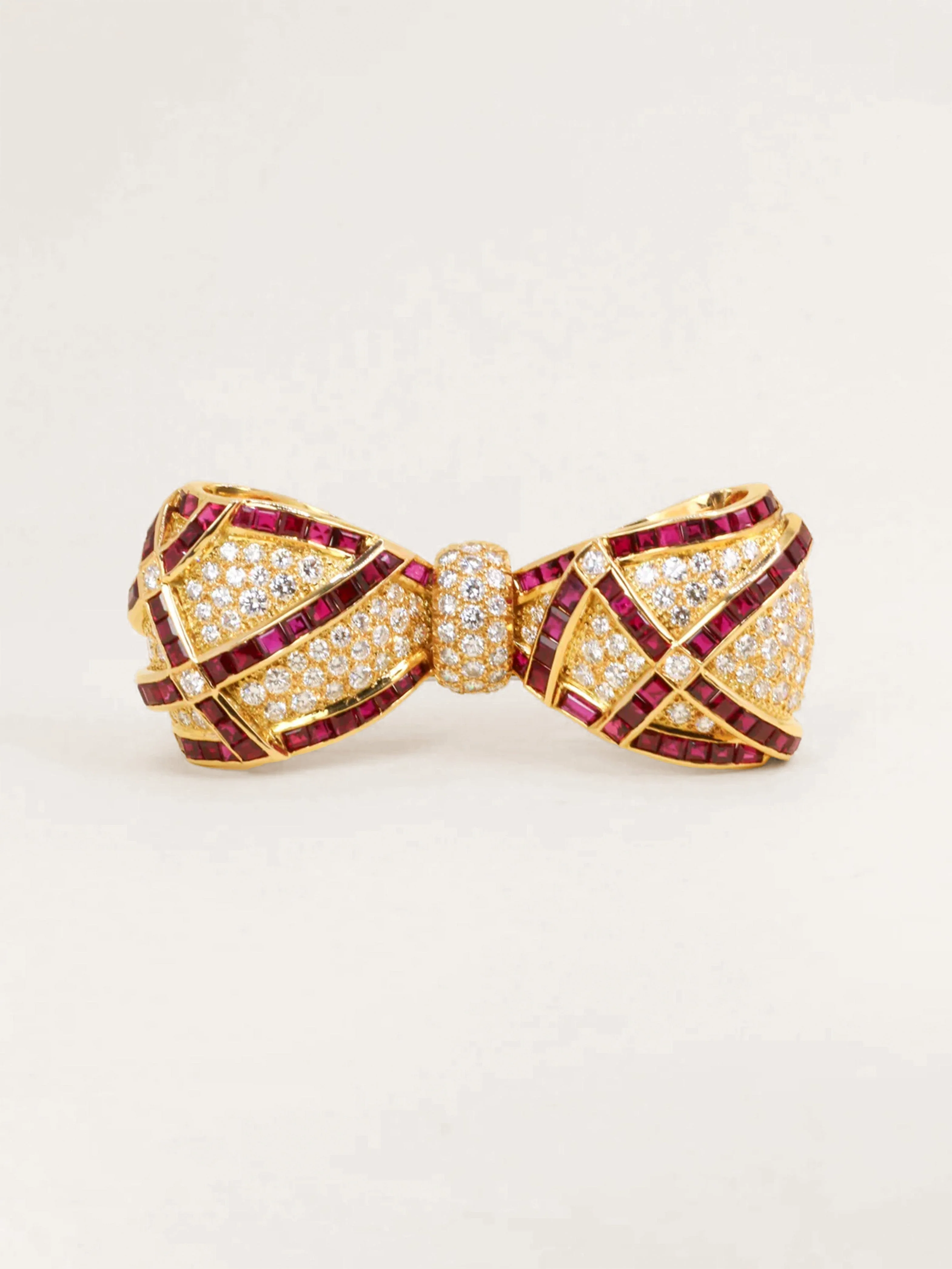 Yellow gold bow brooch with rubies and diamonds 